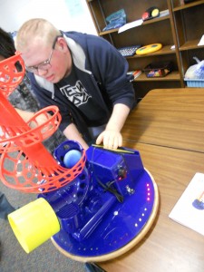 Photo of Student using Switch-Controlled Ball Shooter