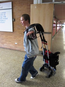 Client walking in the school hallway with the Easy Reach Bookbag