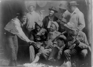Johnny St. Cyr (banjo, far right) and Tom Benton (banjo, center) with Clarence Williams and Armand Piron vaudeville group (circa 1916). Courtesy Hogan Jazz Archive, Tulane University. 