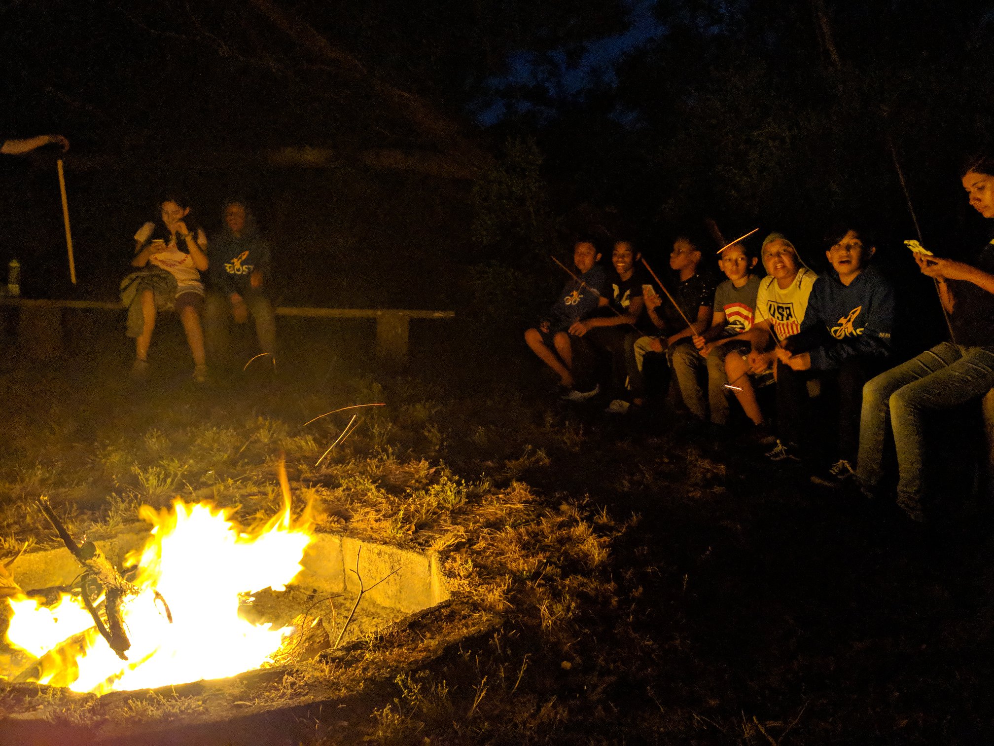 BOOST scholars tell stories around the annual Trinity Center campfire