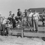 Family on Fence, Courtesy Van Eeden Collection, North Carolina Collection, University of North Carolina Library at Chapel Hill