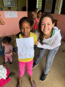 Melissa Marchese with a child in Peru