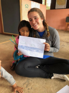 Kelsey Lansdale with a child in Peru