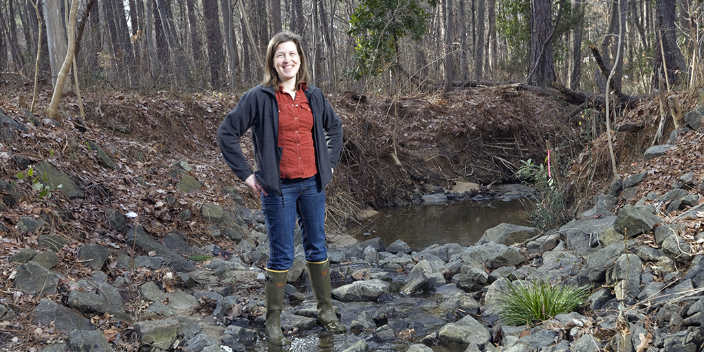 Emily Bernhardt at a creek outside the Phytotron Building on Duke’s campus (Photo: Megan Morr).