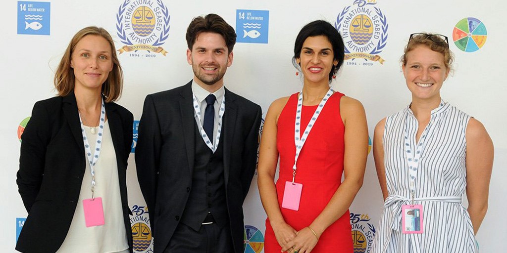 Phillip Turner (second from left) with Aline Jaeckel, Diva Amon, and Jessica Perelman at the 25th Session of the International Seabed Authority in Kingston, Jamaica.