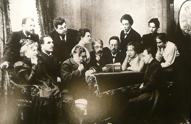 Jan. 2010 photo of image in the Chekhov museum in Badenweiler of Chekhov reading  reading his work "Seagull" to the ensemble of the Moscow Art Theatre, May 1899. Stanislavski stands at Chekhov's left.