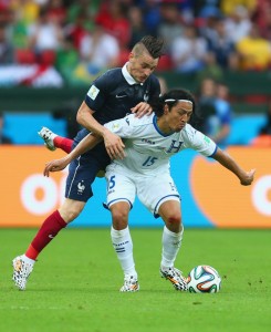 Espinoza fights off a French player during the 2014 World Cup