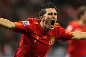 David Villa celebrates one of his many goals in the World Cup campaign. Photo by Oliver Weiken/EPA