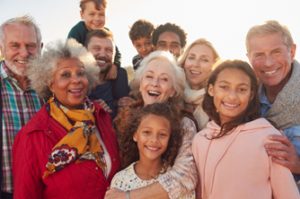 Diverse group of smiling people, young and old.