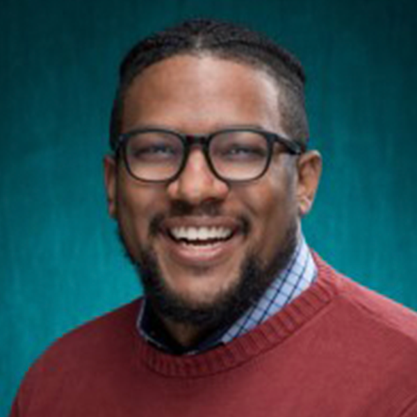 Smiling Black man with glasses