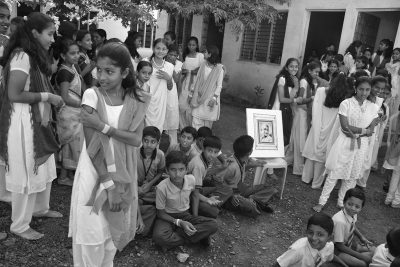 Fig. 1. Cop Shiva, Children in school playground posing with framed poster of Gandhi, rural Karnataka<br /> Photograph from the <em>Being Gandhi</em> series, 2012<br />© Cop Shiva, 2012