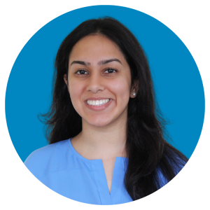 Annika Singh Headshot with a blue background