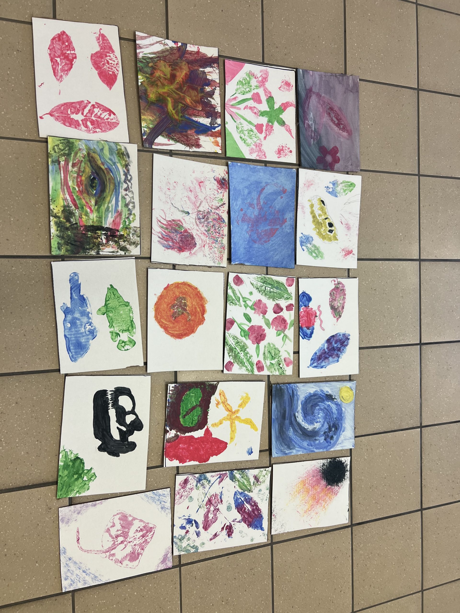 Student showcasing resilience paintings.