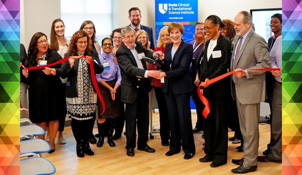 Dr. L. Kristin Newby and Dr. Ebony Boulware celebrate with the TransPop team and community stakeholders during the ribbon-cutting ceremony for Duke CTSI’s space expansion at the NC Research Campus.