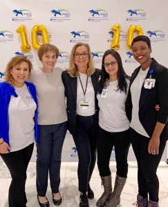 L. Kristin Newby, M.D., celebrates the 10th anniversary of the MURDOCK Study with TransPop staff.