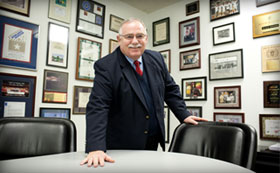 Man standing behind a table