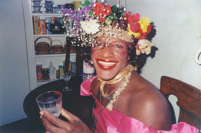 Marsha P. Johnson sitting at table