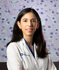 Photo of Giselle Lopez with Oligodendroglioma Tumor in background