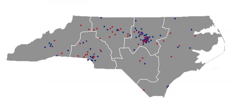Map of North Carolina, showing red and blue dots spread throughout the state with white borders dividing regions of the state.