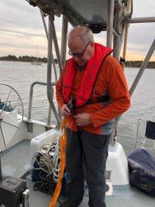 Bill (UNCW) learning the ins and outs of his life jacket and harness.