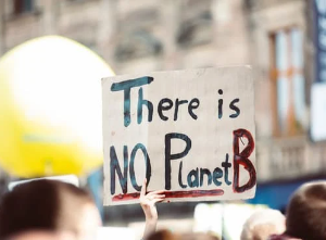 Demonstators with sign "There is no planet B"