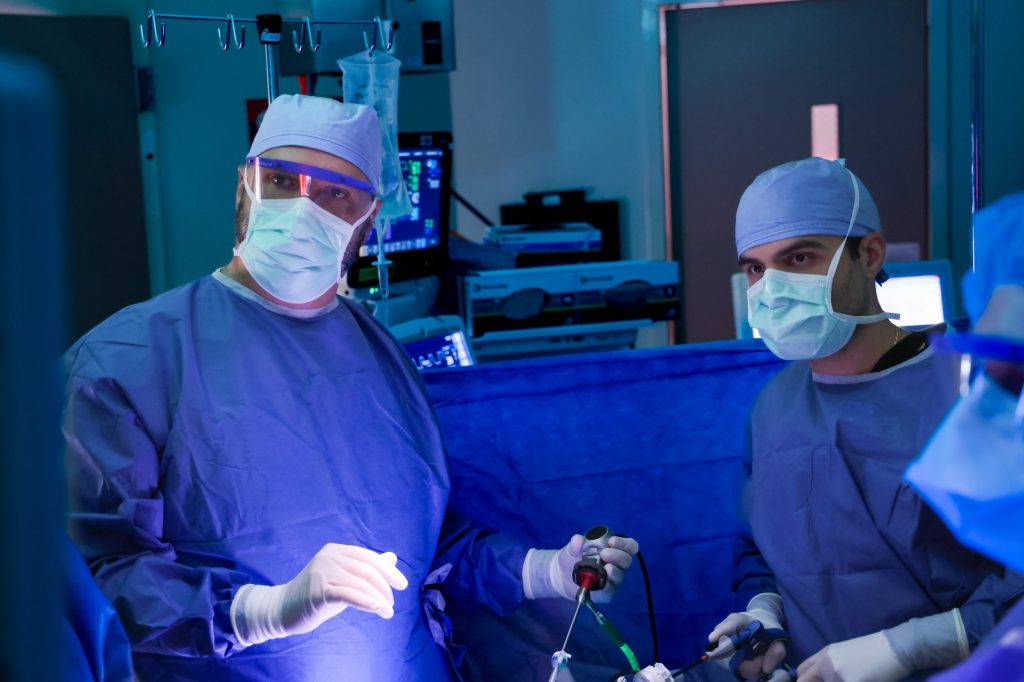 Dr. Jacob Greenberg assists general surgery resident Dr. Konstantinos Economopoulos with a procedure at the Davis Ambulatory Surgery Center (DASC) near Duke Regional Hospital.