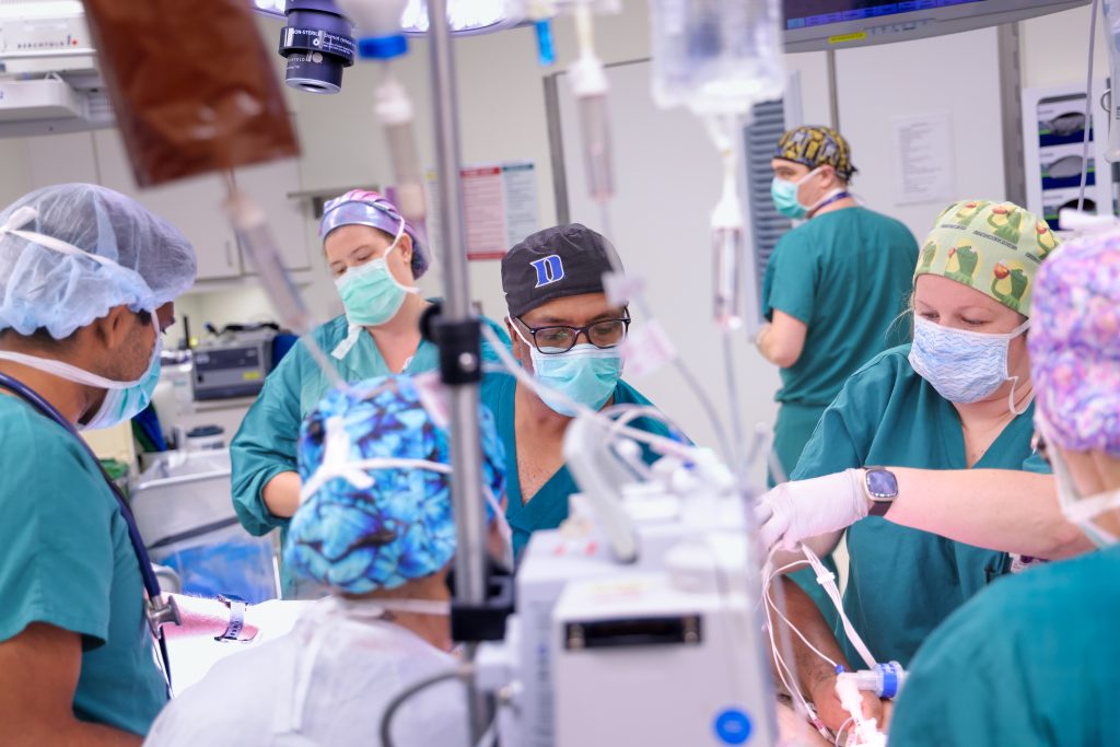 Surgical staff and nurses prepare the operating room for a surgery